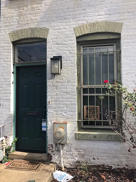 front of row house, just a few doors down from local Tex-Mex cantina. - 33 N St NW
