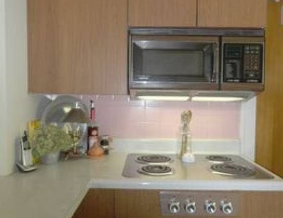 There's a built in microwave, and a stainless electric oven range!