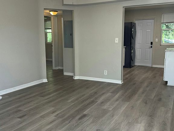 looking into the living room and kitchen from the front door