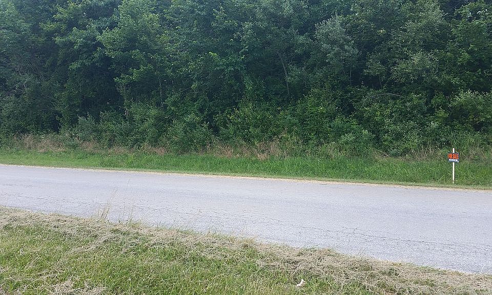 3 Wooded acres just outside limits