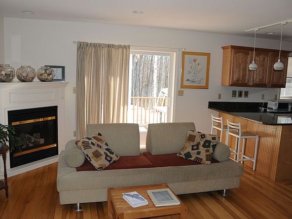 sliding doors to deck, fireplace