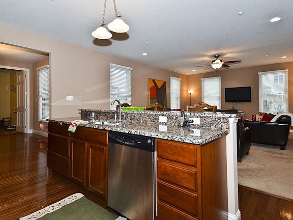 Hardwood, granite, raised breakfast bar
