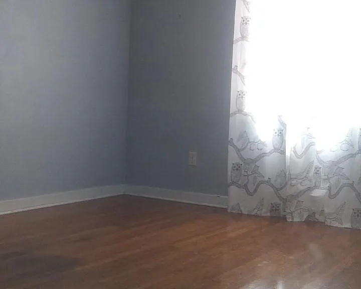 Hardwood floors in bedrooms.