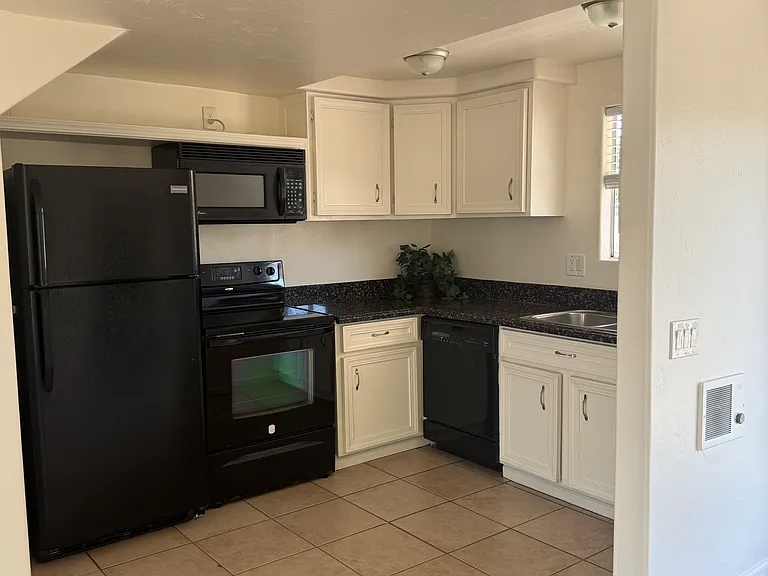 Kitchen with Refrigerator, Stove, Dishwasher and Microwave