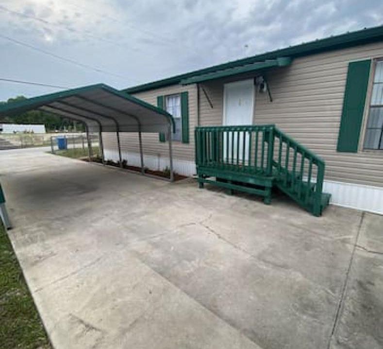 Extended driveway with large carport. There's also a 220 Volt plug in case you need to plug in an RV.