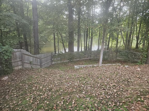 Lake In Fenced In Back Yard