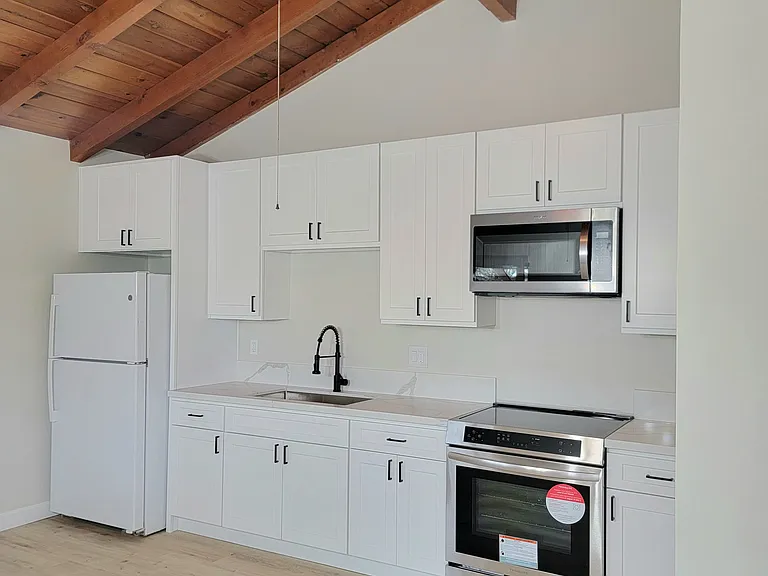 Brand new kitchen with brand new stove and microwave to cook to your hearts delight! Refrigerator also included!