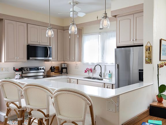 Kitchen with new stainless appliances and eat-up counter.