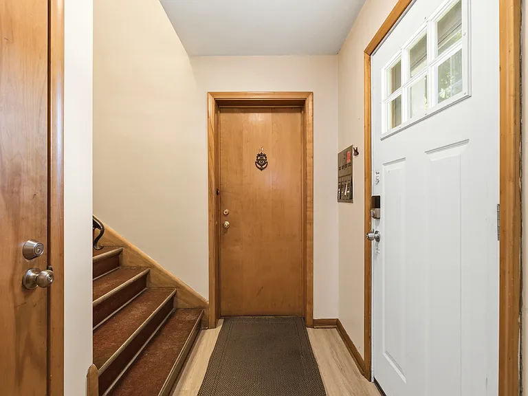 Inside the front door. Note the inside mailboxes on the wall.
