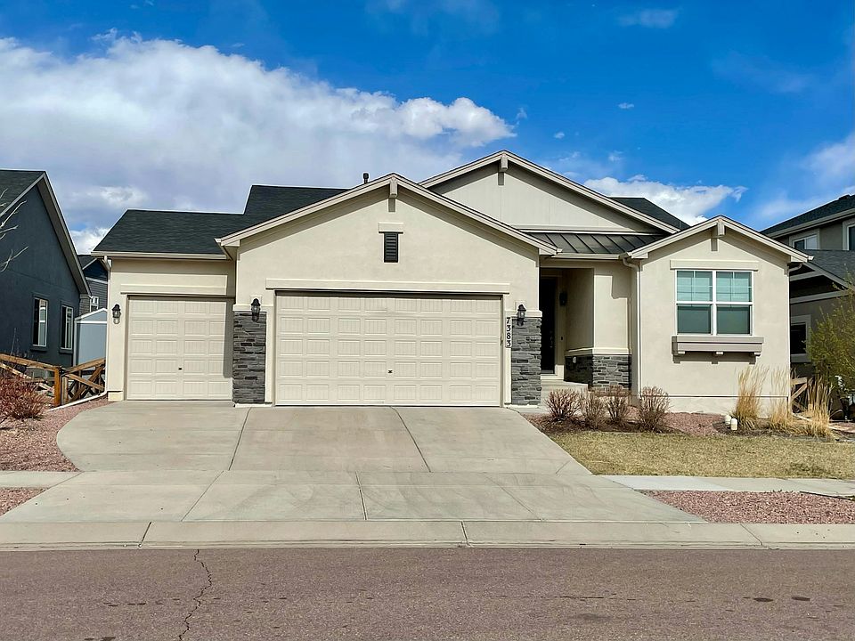 Front showing 3.5 car garage (extra 0.5 adds depth to single bay)