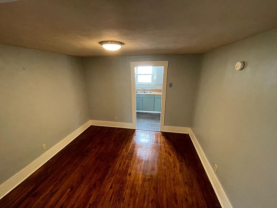 The dining room is cozy and serves as a pass-through to the kitchen.