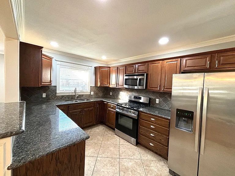 Kitchen that includes the refrigerator