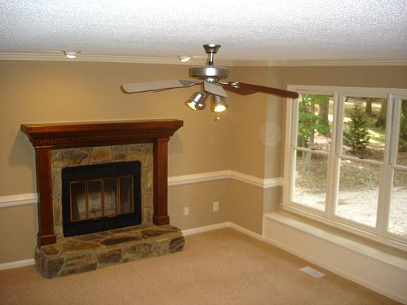 Warm coszy Cherry mantle fireplace in Family Room