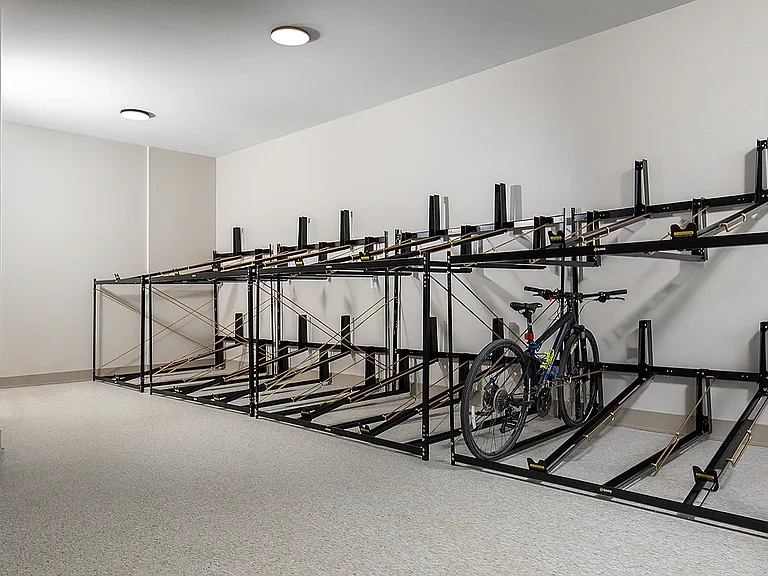 Experience the convenience of secure and stylish bike storage in your modern apartment complex.