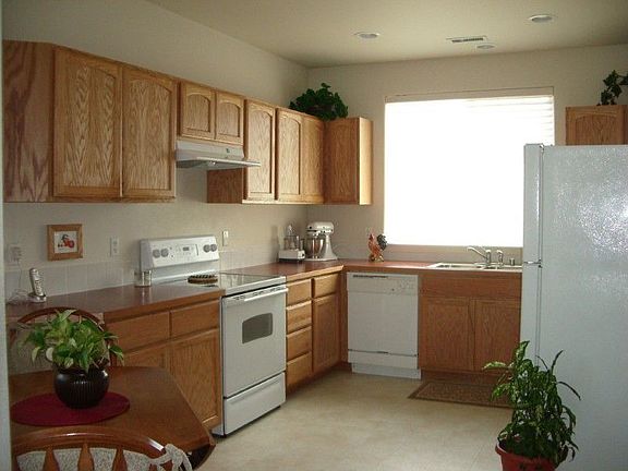 Darling kitchen with oak cabinets, all white GE appliances. Refrig, washer and dryer negotiable. Lar