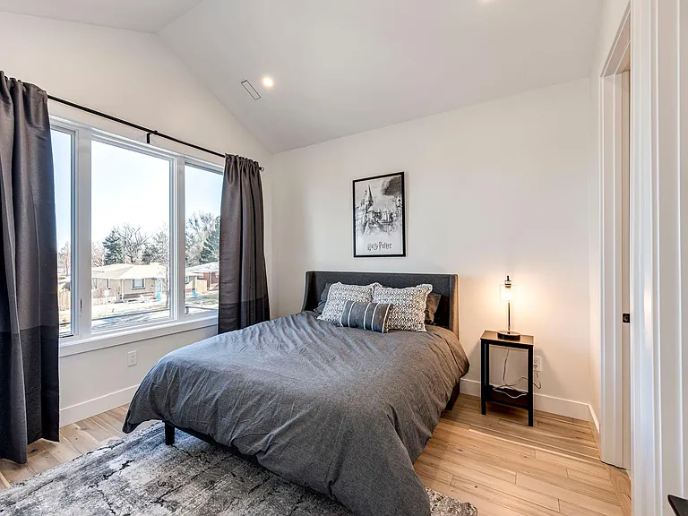 3rd bedroom on the upper level with queen size bed and private bathroom.