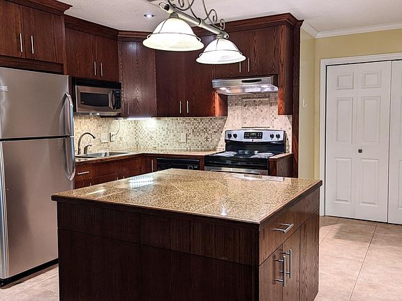 Kitchen with Granite Countertops and Oak Cabinets