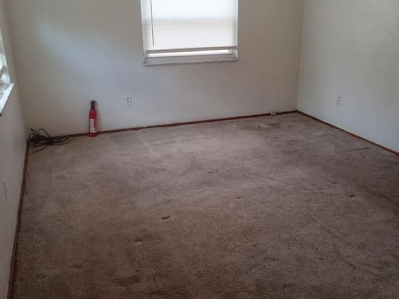 Master bedroom - ( 2nd wide shot) has celing fan, big closet and two windows and nook area big enough for desk or chest of draws or dresser.