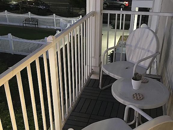 Private balcony with bistro table and chairs