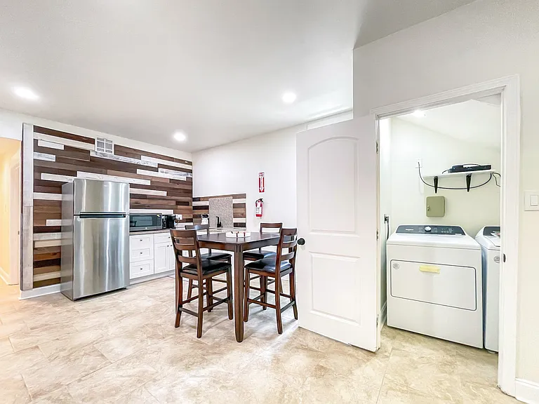 Downstairs common area, kitchen and laundry