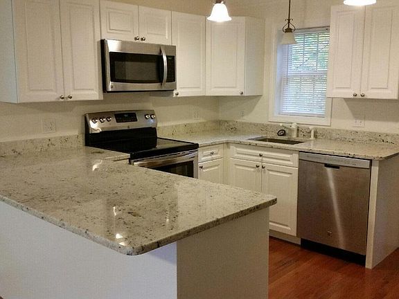 Kitchen with granite counter-tops and stainless steel appliances
