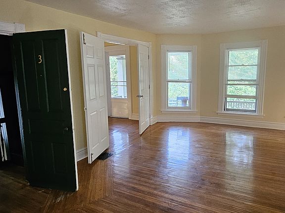 Living room attached to front door and office.