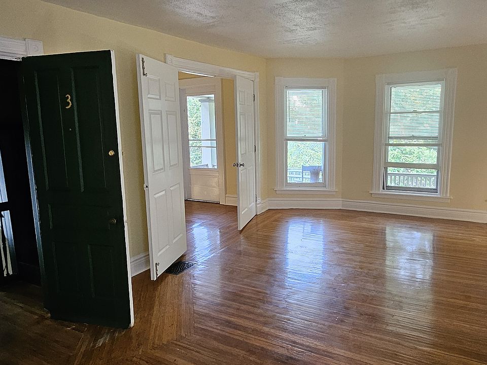 Living room attached to front door and office.