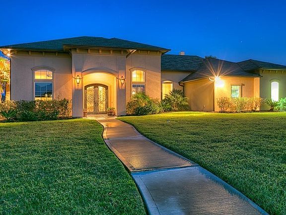 Welcome to one of the finest Waterfront, Custom designed homes on Lake Conroe! Designed by Mark Todd and built by Morris Builders.