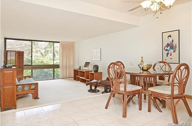 Open split level floor plan from dining area to living room.