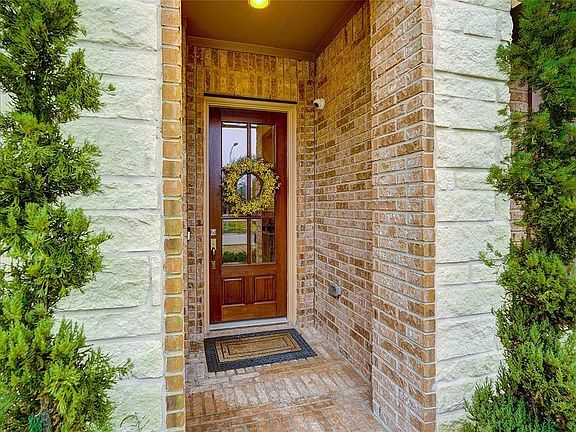 Beautiful Glass Wood Pained door that welcomes you to the home.
