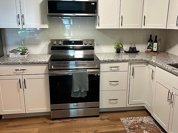 Newly renovated kitchen including floor, cabinets and appliances