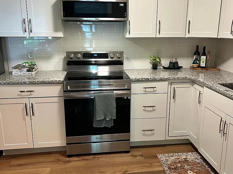 Newly renovated kitchen including floor, cabinets and appliances
