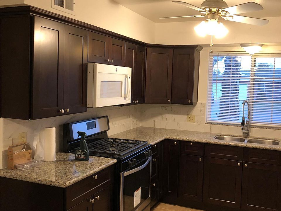 kitchen with new cabinents, new gas stove and new faucets, garbage disposal and granite with accented back and lazy Suzan cabinent.