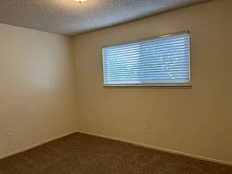Second bedroom with new paint and new blinds