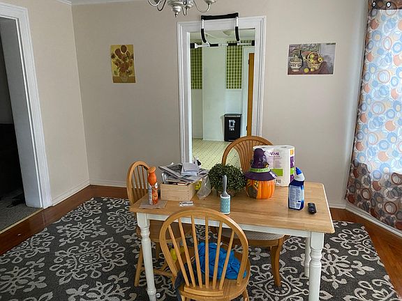looking into dining room from side entrance and sun room.
