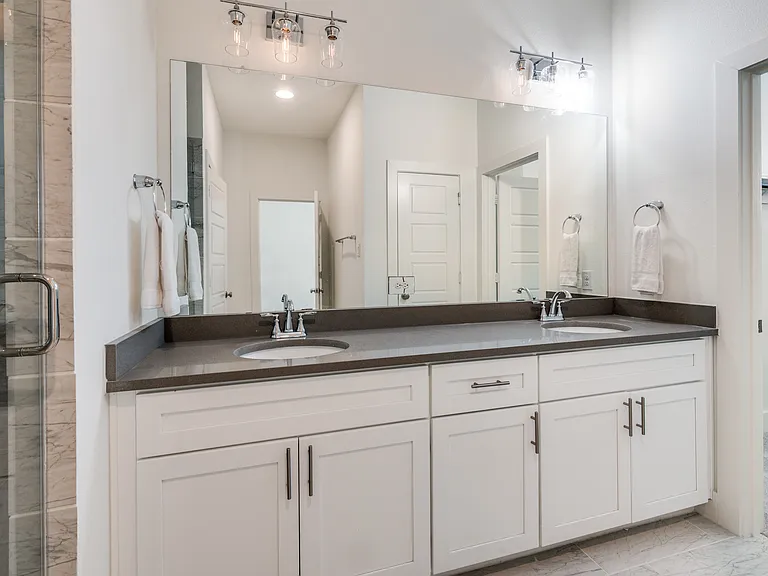 Master bathroom: private en suite full master bathroom with double vanity, walk-in shower with bench, private toilet and entrance to master walk-in closet.