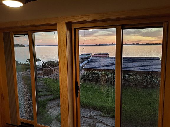 View from the Living room to the pool, and dock.