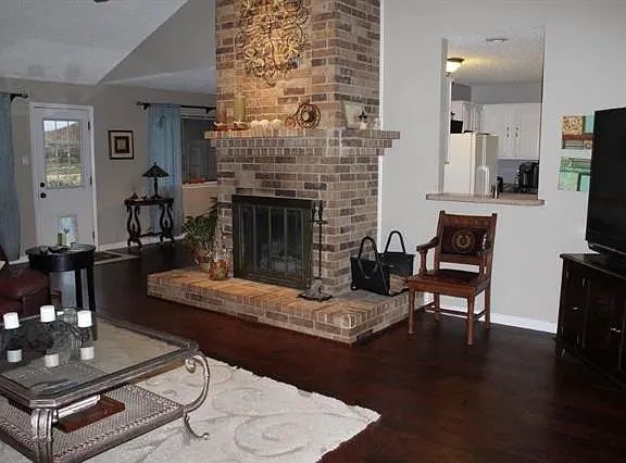 Wood burning fireplace in living area.