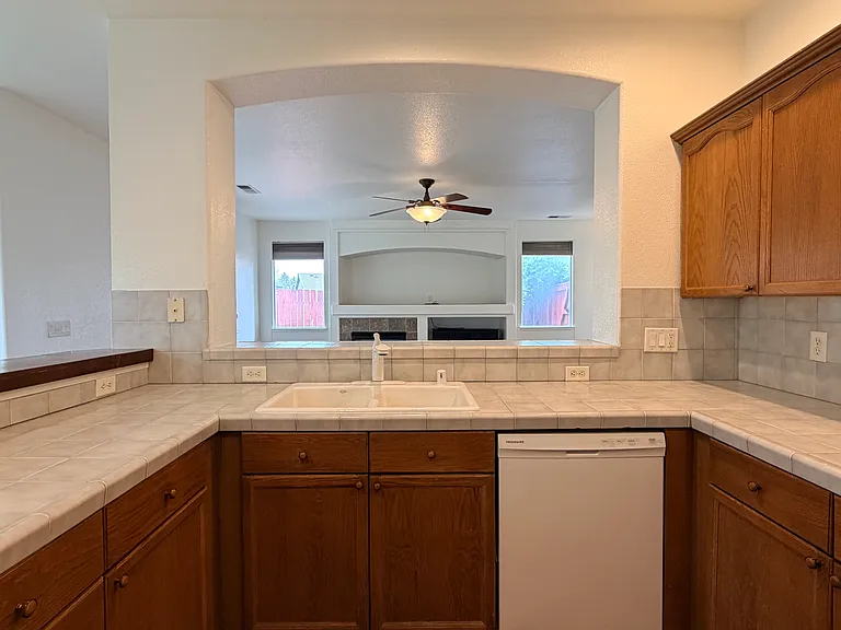 Kitchen looking into living room
