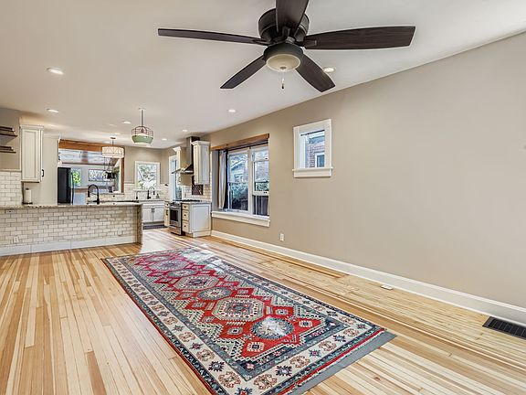 Open Living and gleaming hardwood floors.