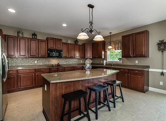 Large island w/seating & an abundance of counter-space allows the family chef plenty of room to cook & entertain.