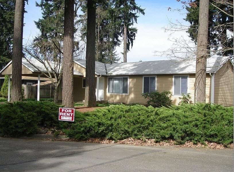 Front of House with mature plantings