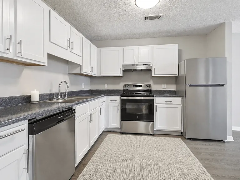 Cook with ease in updated kitchens with crisp white cabinetry and stainless steel appliances, professionally operated by Highlands Vista Group.