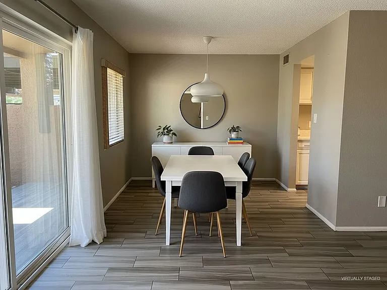 Your dining experience-virtually staged. Imagine savoring your comfort meals daily in this warm space. Note. Hanging lamp and curtains are actually neutral colors not white.