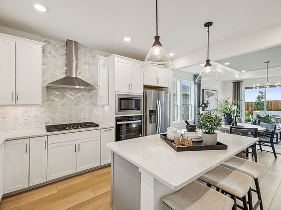 Spacious kitchen with pendant lighting