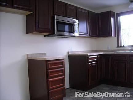Kitchen.
						:
						Inside Wall with New Stainless Steel Over the Stove Microwave
