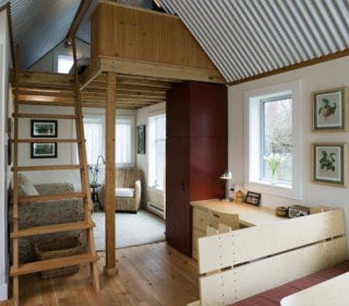Main level includes living area, built-in desk and dining banquette.