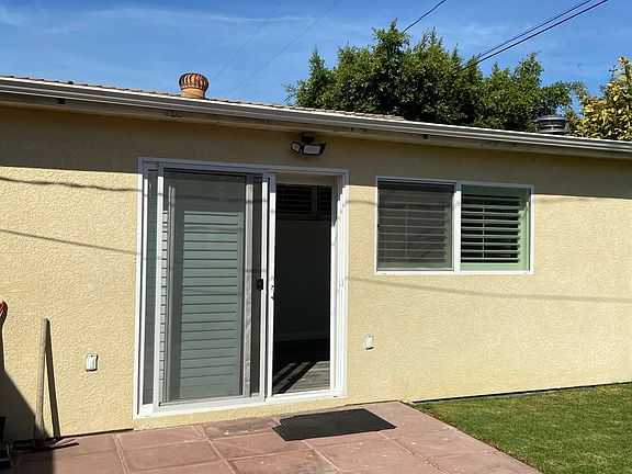 Main entrance to the unit with Plantation shutters