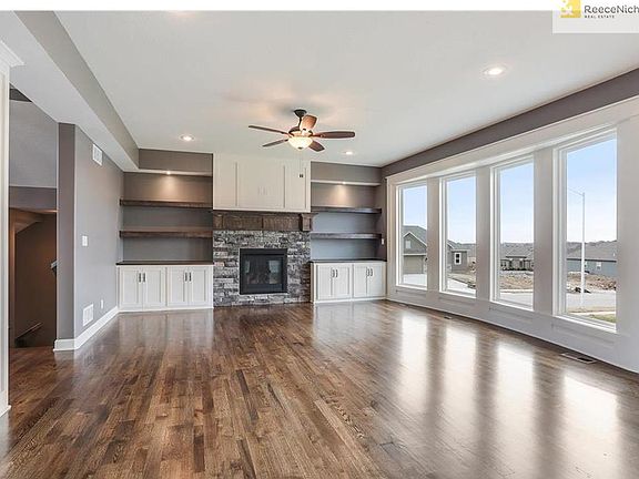 WOW, open living room, hardwood, stone fireplace, built-in's