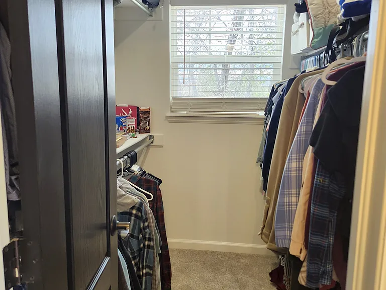 Walk-in closet located in primary bedroom